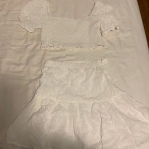 Brand new 2 piece shirt and skirt set.